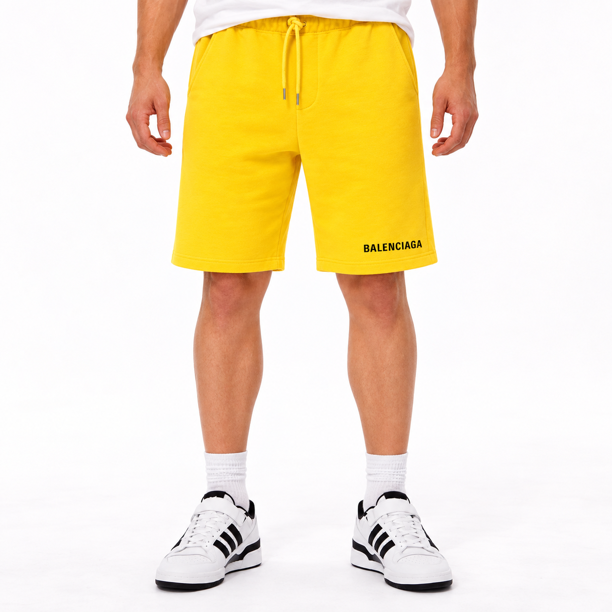 Men's Balenciaga athletic fleece shorts in Yellow, front view