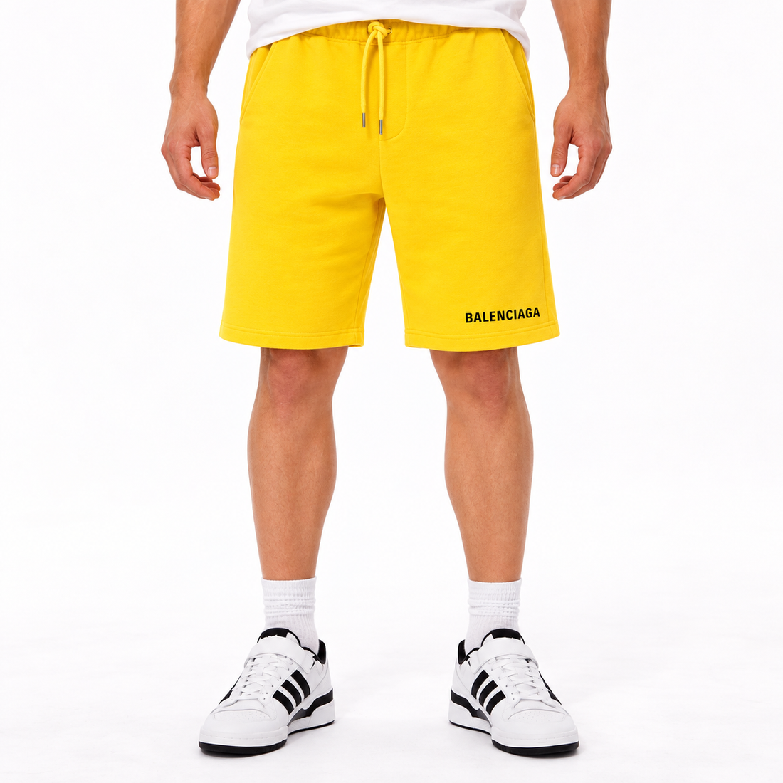 Men's Balenciaga athletic fleece shorts in Yellow, front view