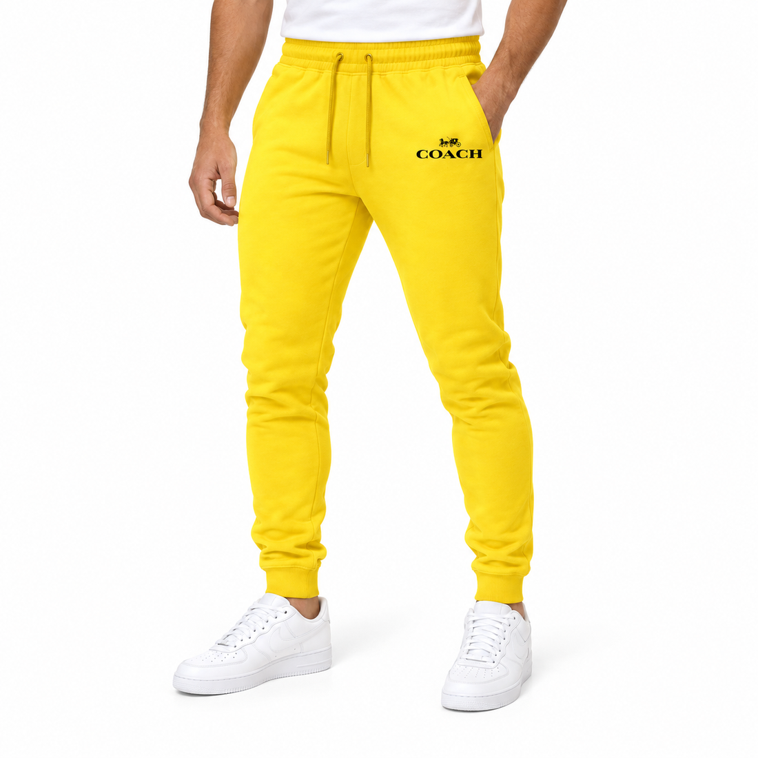 Coach sweatpants in Yellow, model view