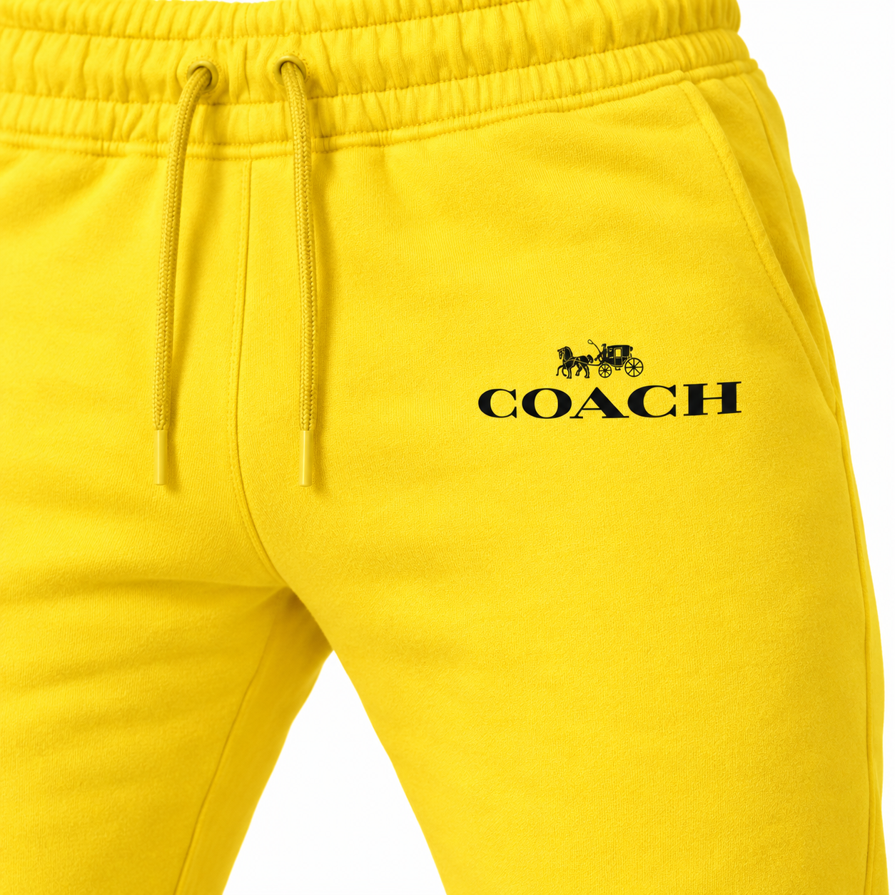 Coach sweatpants in Yellow, print and waistband detail